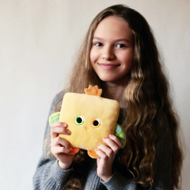 Plush toy chick stuffed animal bird with a useful back pocket, designed by young entrepreneurs